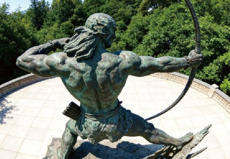 bronze figure sculpture of a male archer drawing a bow