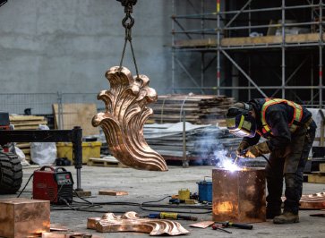 Professional welding of a large-scale bronze sculpture at Wensculp factory, demonstrating the factory-direct pricing advantage for international project contractors