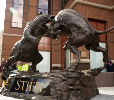 Dynamic hyper-realistic fighting bull and bear bronze statue for financial district landmark based on expert artistic restoration
