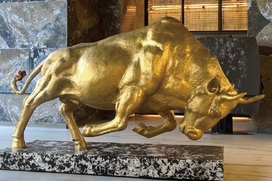 Luxury custom bronze bull sculpture with gold leaf finish for high-end office lobby and financial district decor