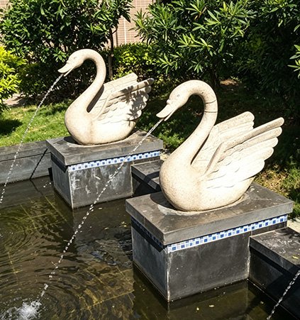 Swan sculptures in a water feature demonstrating our Durability Standards , validated by FEA analysis to ensure long-term resistance to salt-spray corrosion and UV exposure.
