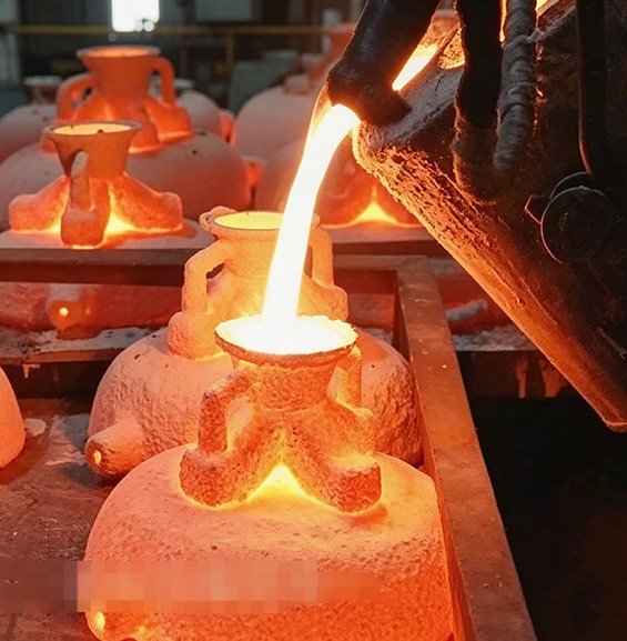 Professional molten metal pouring at the foundry, illustrating The Lost-Wax Casting Process and our Induction Melting & Precision Casting standards for monumental sculptures.