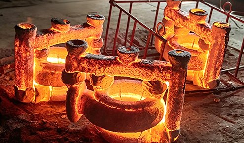 Red-hot ceramic shells at the foundry for Cast Sculptures , utilizing the lost-wax process to achieve high-fidelity for Figurative Statuary and Intricate Geometries .