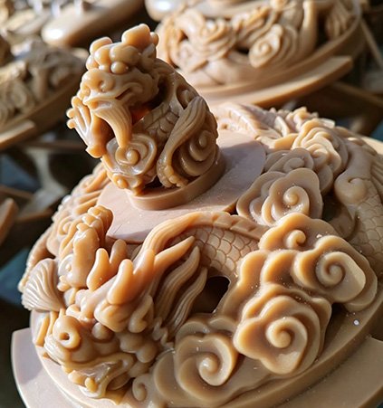 An intricately detailed wax pattern of a dragon vessel demonstrating our Materials and Craftsmanship, utilizing 88% tin bronze and museum-quality hand-polishing.