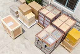 Professional sea-worthy wooden crating and global delivery logistics for monumental bronze statues, ensuring safe arrival at the project site.