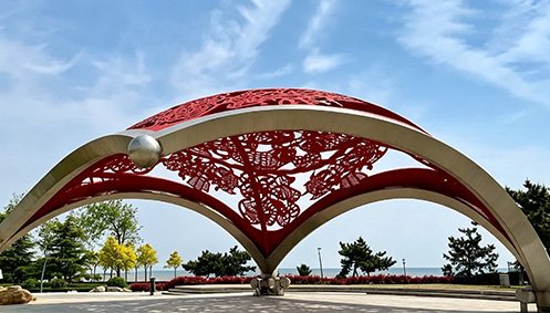 Large stainless steel landscape pergola sculpture at Rongcheng Coastal Park, Shandong