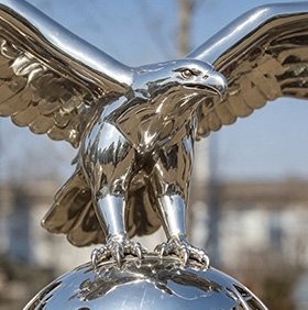 Stainless steel eagle sculpture with spread wings