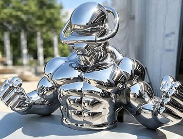 Custom mirror-polished stainless steel figure sculpture