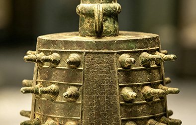 Single bronze chime bell showing almond-shaped cross section
