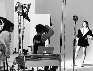  Professional photo studio setup for capturing reference angles of a person for a custom bronze bust