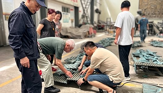 Clients inspecting bronze castings in progress at the Wensculp workshop