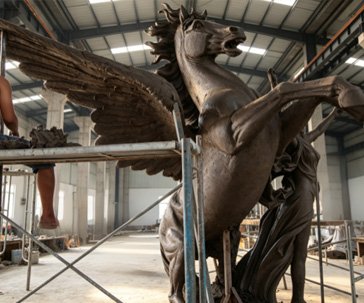 Full-scale clay sculpting of custom fiberglass sculpture