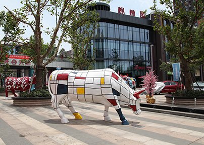 Custom fiberglass cow sculpture at Guanggu Tiandi, Wuhan